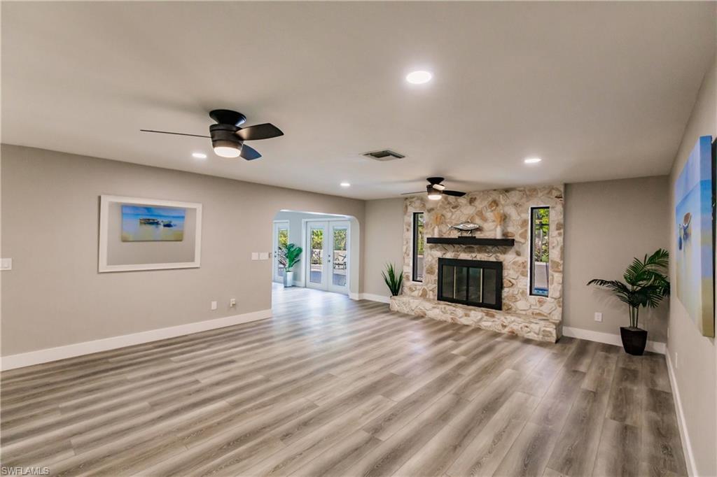 362 Pinehurst Circle Naples, FL 34113 - Photo 15 of 50 a view of an empty room with kitchen and a window