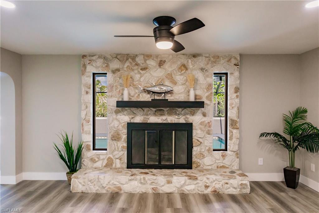 362 Pinehurst Circle Naples, FL 34113 - Photo 18 of 50 a living room with furniture and a fireplace