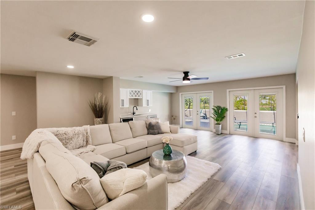 362 Pinehurst Circle Naples, FL 34113 - Photo 2 of 50 a living room with furniture and wooden floor