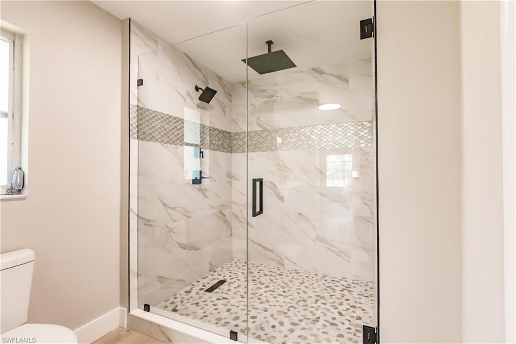 362 Pinehurst Circle Naples, FL 34113 - Photo 22 of 50 a bathroom with a shower