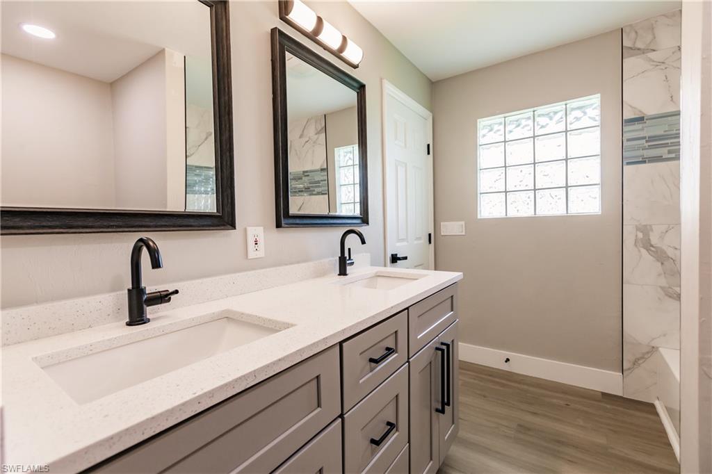 362 Pinehurst Circle Naples, FL 34113 - Photo 33 of 50 a bathroom with a sink and a mirror