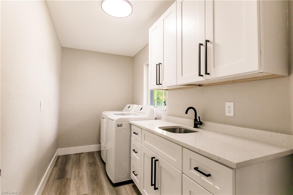 362 Pinehurst Circle Naples, FL 34113 - Photo 36 of 50 a kitchen with sink and cabinets