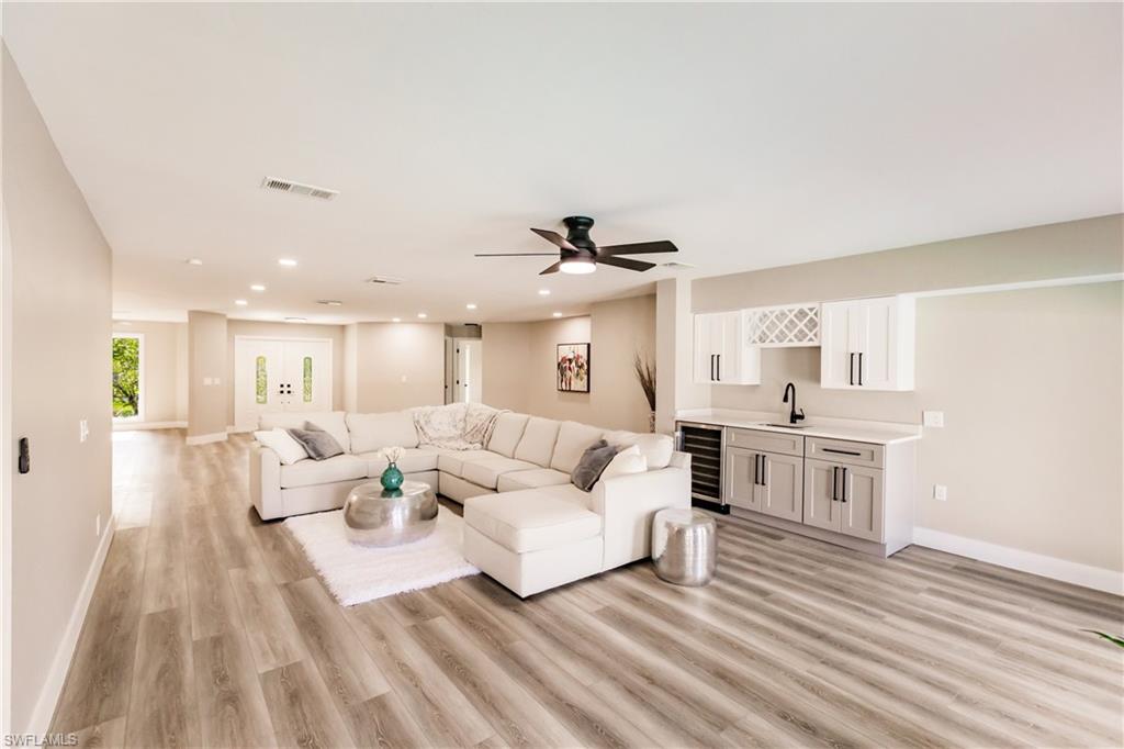 362 Pinehurst Circle Naples, FL 34113 - Photo 4 of 50 a living room with furniture and a wooden floor