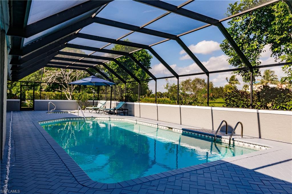 362 Pinehurst Circle Naples, FL 34113 - Photo 41 of 50 a view of a swimming pool with a patio