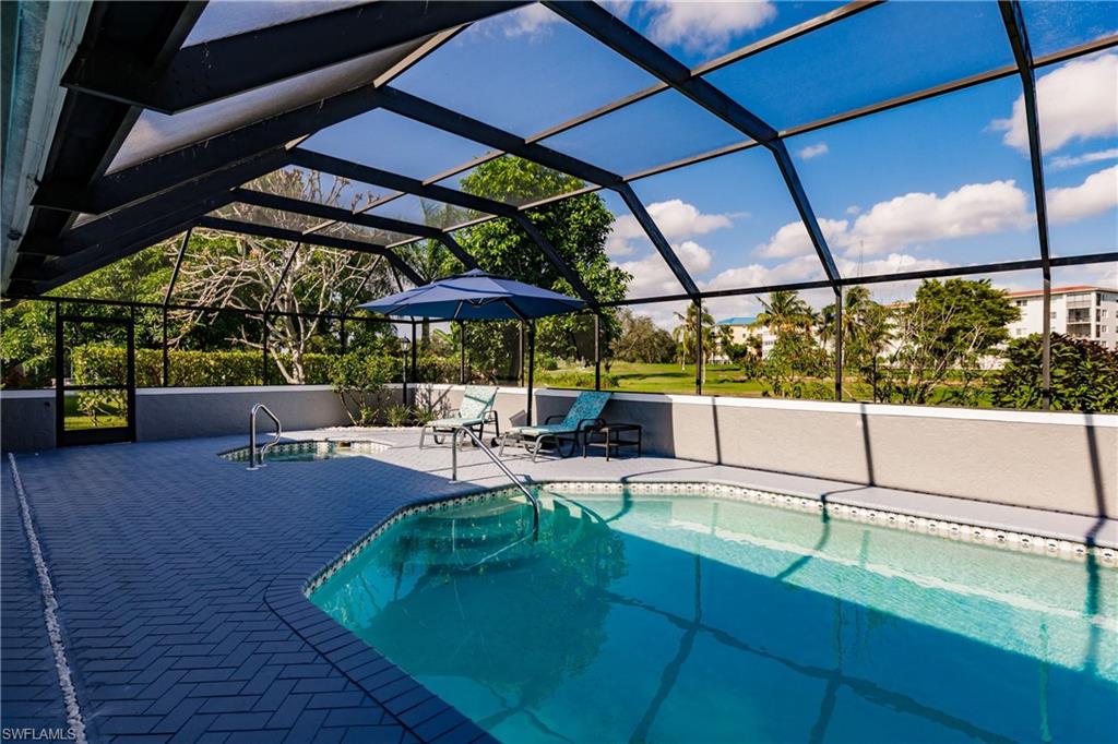 362 Pinehurst Circle Naples, FL 34113 - Photo 44 of 50 a view of backyard with swimming pool and sitting area