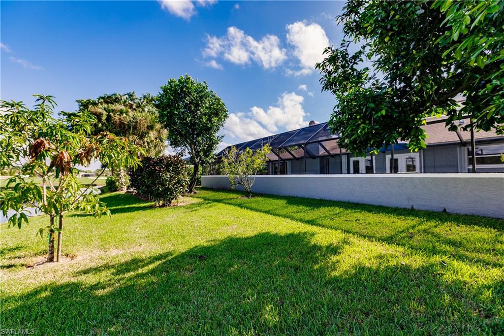 362 Pinehurst Circle Naples, FL 34113 - Photo 47 of 50 a view of a house with a yard