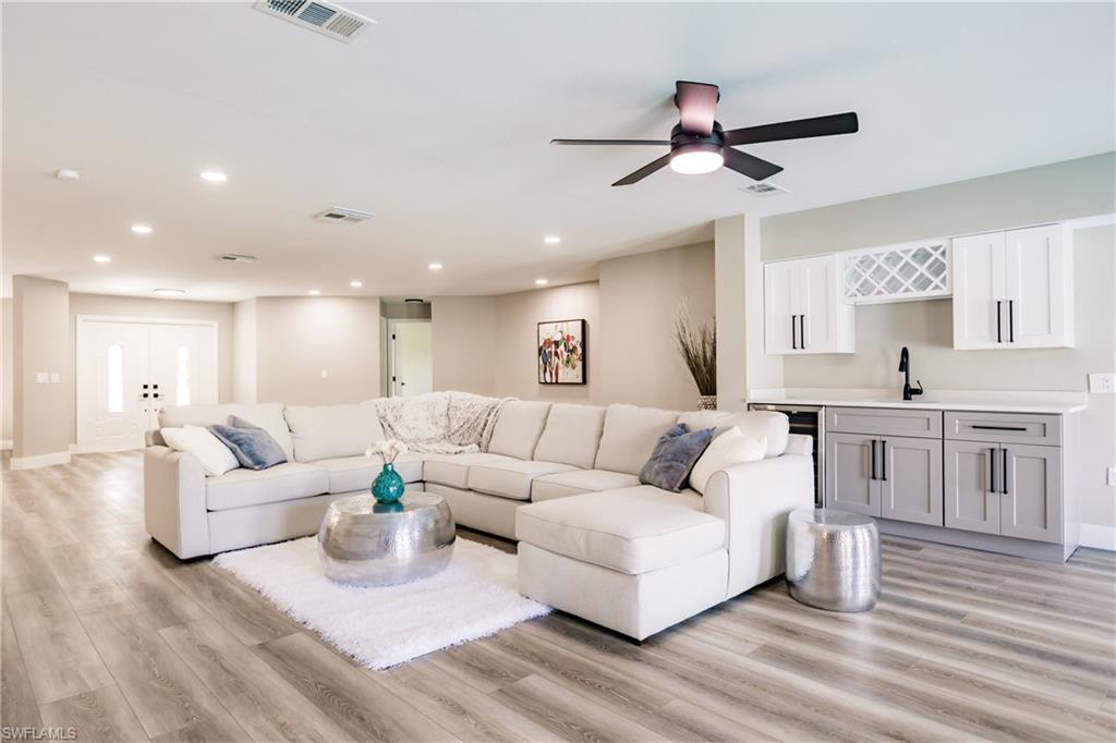 362 Pinehurst Circle Naples, FL 34113 - Photo 5 of 50 a living room with furniture and kitchen view