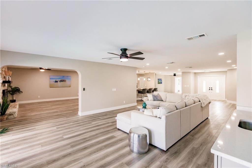 362 Pinehurst Circle Naples, FL 34113 - Photo 6 of 50 a living room with furniture and a wooden floor