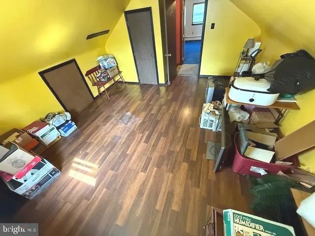 a view of a living room with wooden floor