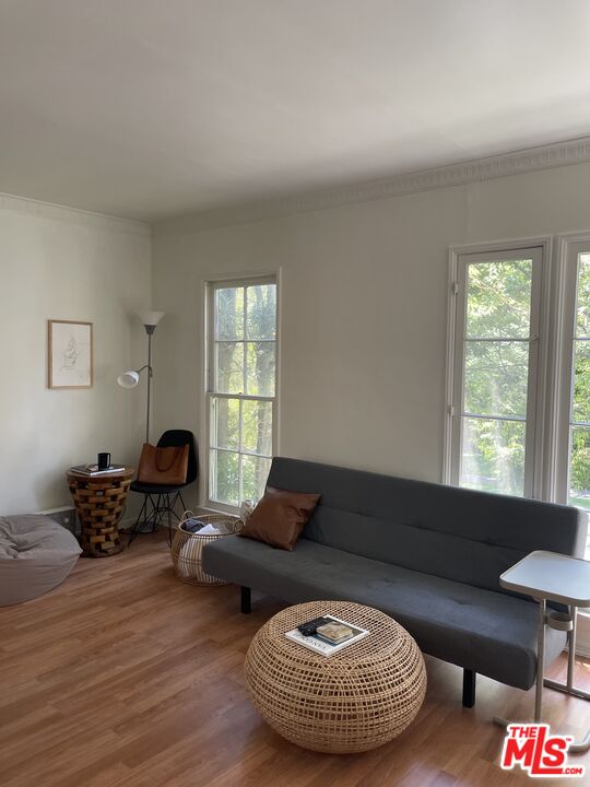 200 South Reeves Drive, Unit 7 Beverly Hills, CA 90212 - Photo 3 of 10 a living room with furniture and a window