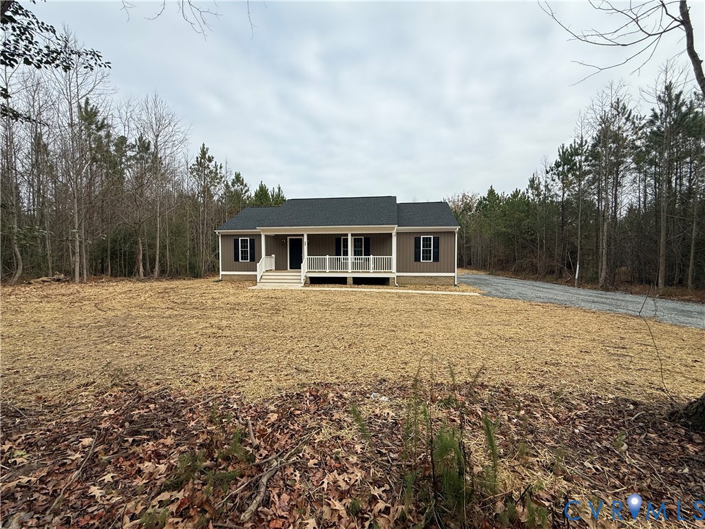 342 Barefords Mill Road Dunnsville, VA 22454 - Photo 1 of 15 a house with yard in front of it