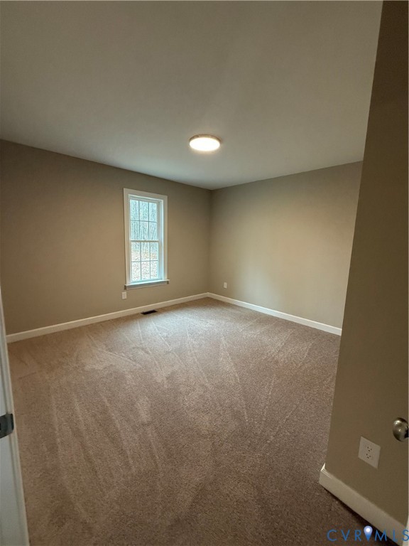 342 Barefords Mill Road Dunnsville, VA 22454 - Photo 14 of 15 an empty room with windows
