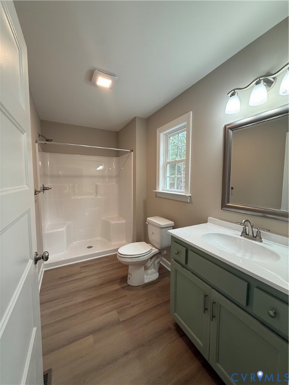 342 Barefords Mill Road Dunnsville, VA 22454 - Photo 6 of 15 a bathroom with a double vanity sink toilet mirror and window