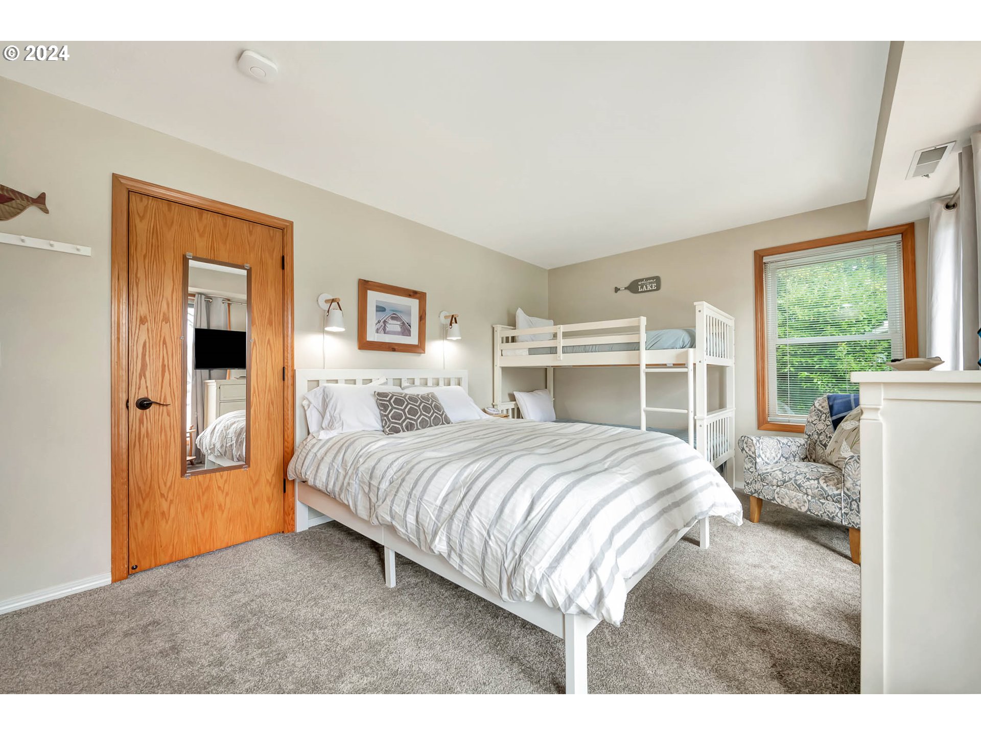 5378 Buckskin Bob Road Florence, OR 97439 - Photo 23 of 46 a bedroom with a bed and a large window