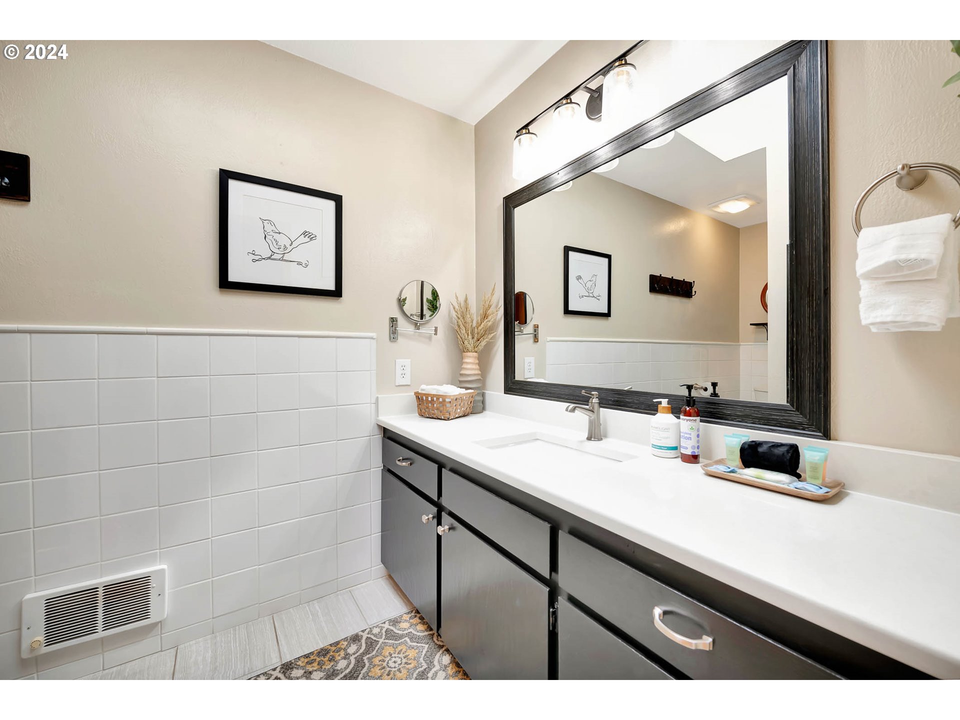 5378 Buckskin Bob Road Florence, OR 97439 - Photo 25 of 46 a bathroom with a sink and a mirror