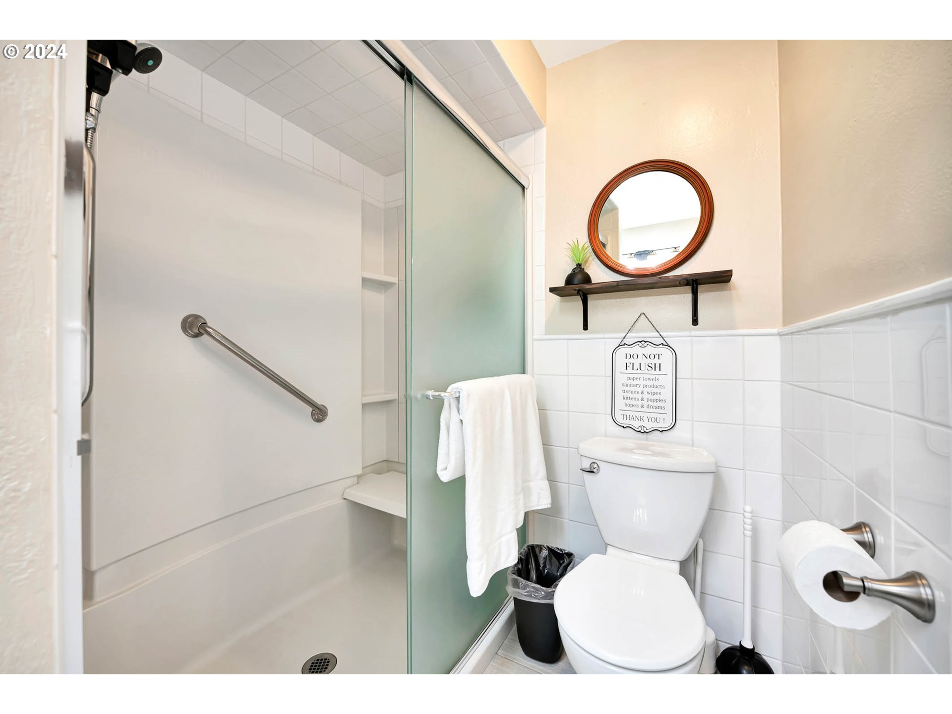 5378 Buckskin Bob Road Florence, OR 97439 - Photo 26 of 46 a white toilet sitting next to a bathroom sink