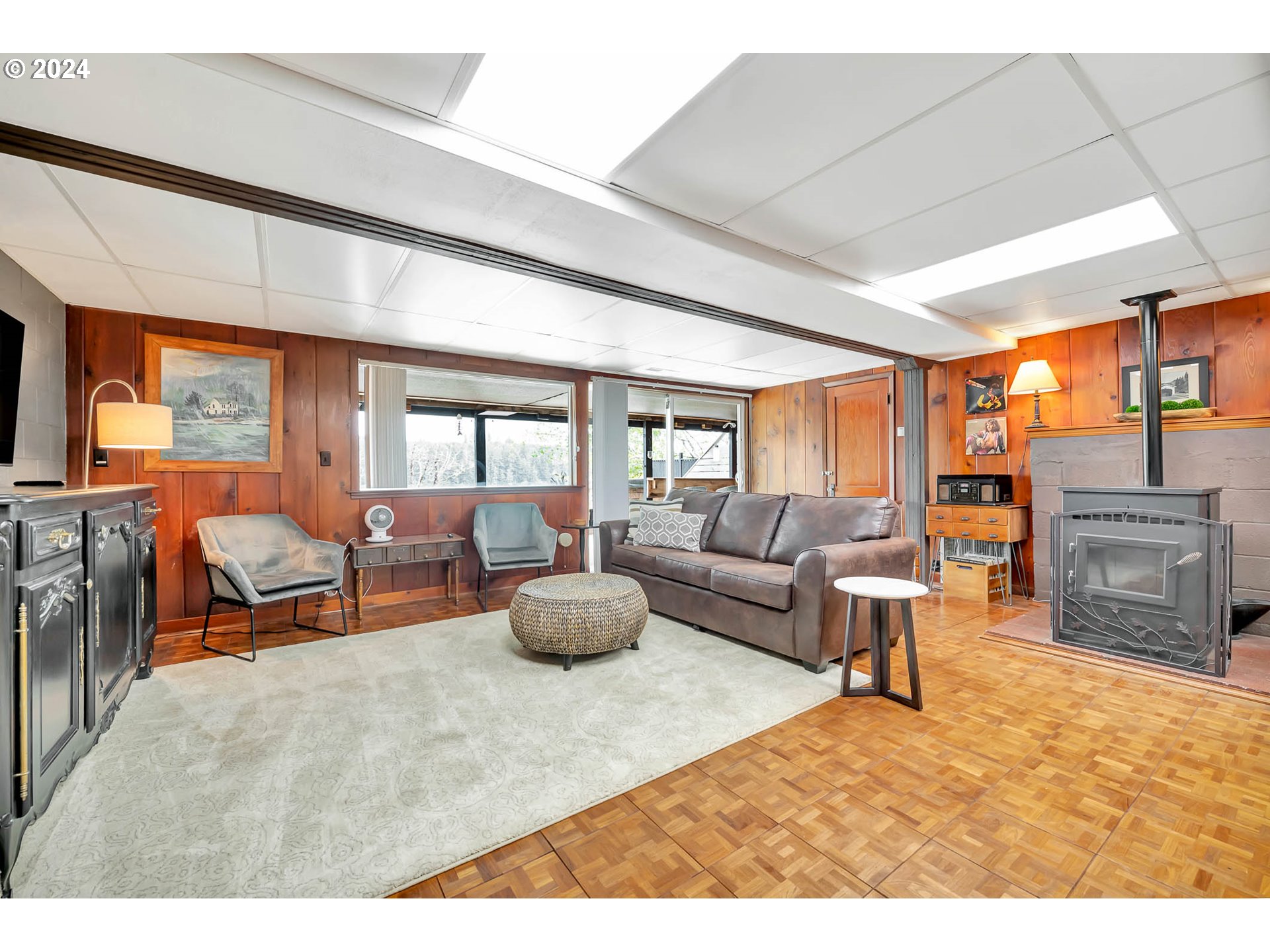 5378 Buckskin Bob Road Florence, OR 97439 - Photo 27 of 46 a living room with furniture a fireplace and a large window