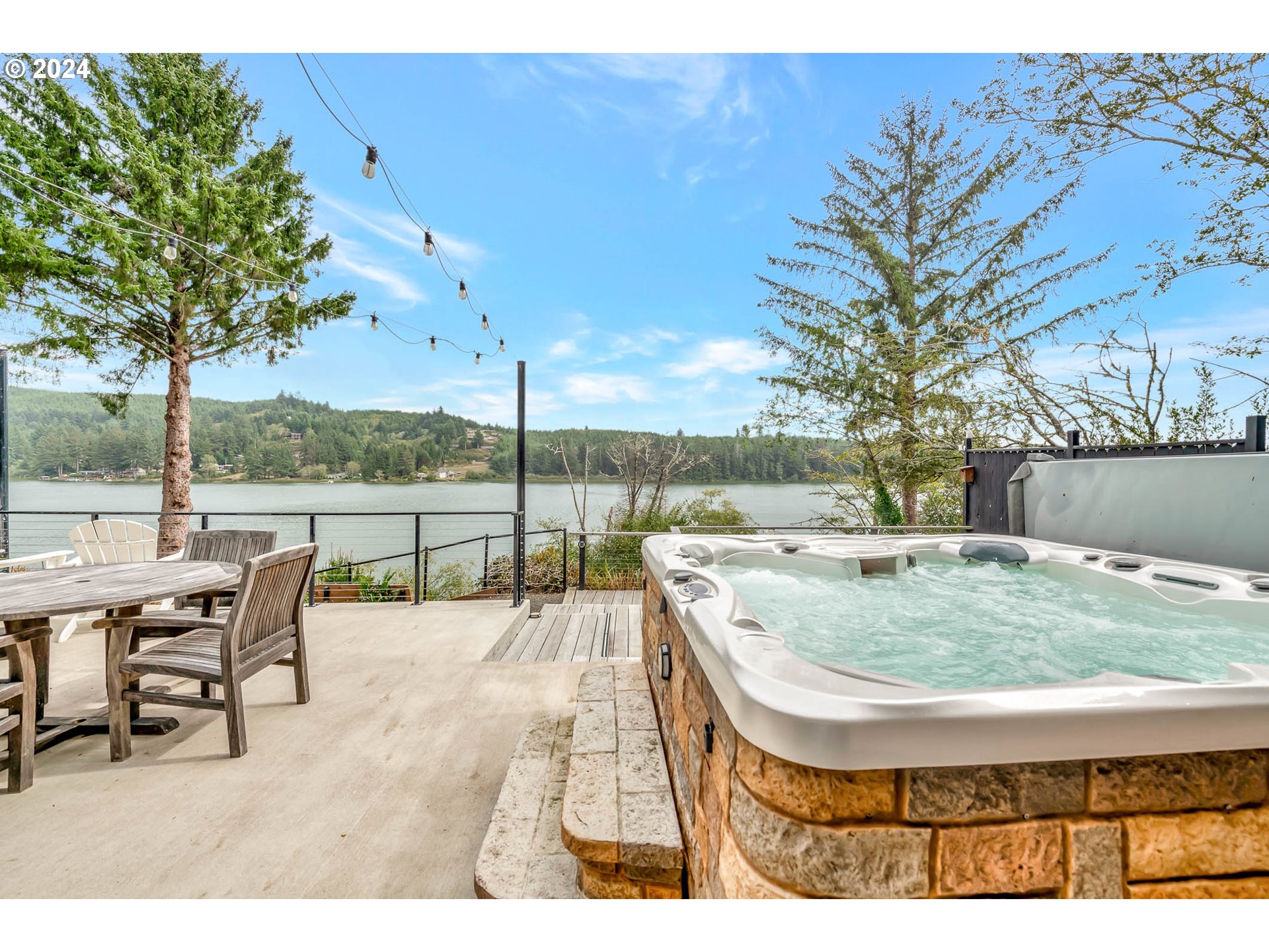 5378 Buckskin Bob Road Florence, OR 97439 - Photo 32 of 46 a view of a patio with a table and chairs