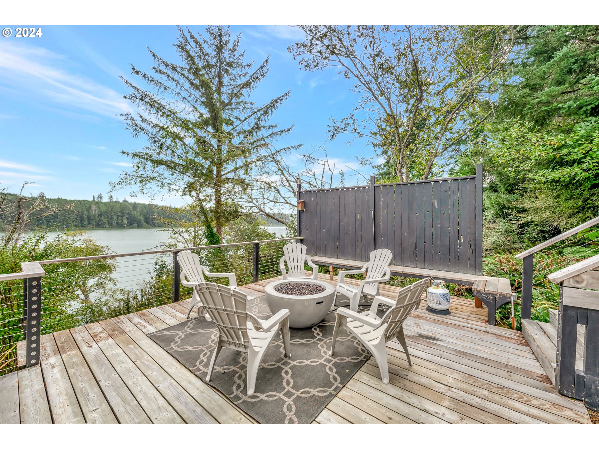 5378 Buckskin Bob Road Florence, OR 97439 - Photo 34 of 46 a view of a table and chairs on the roof deck