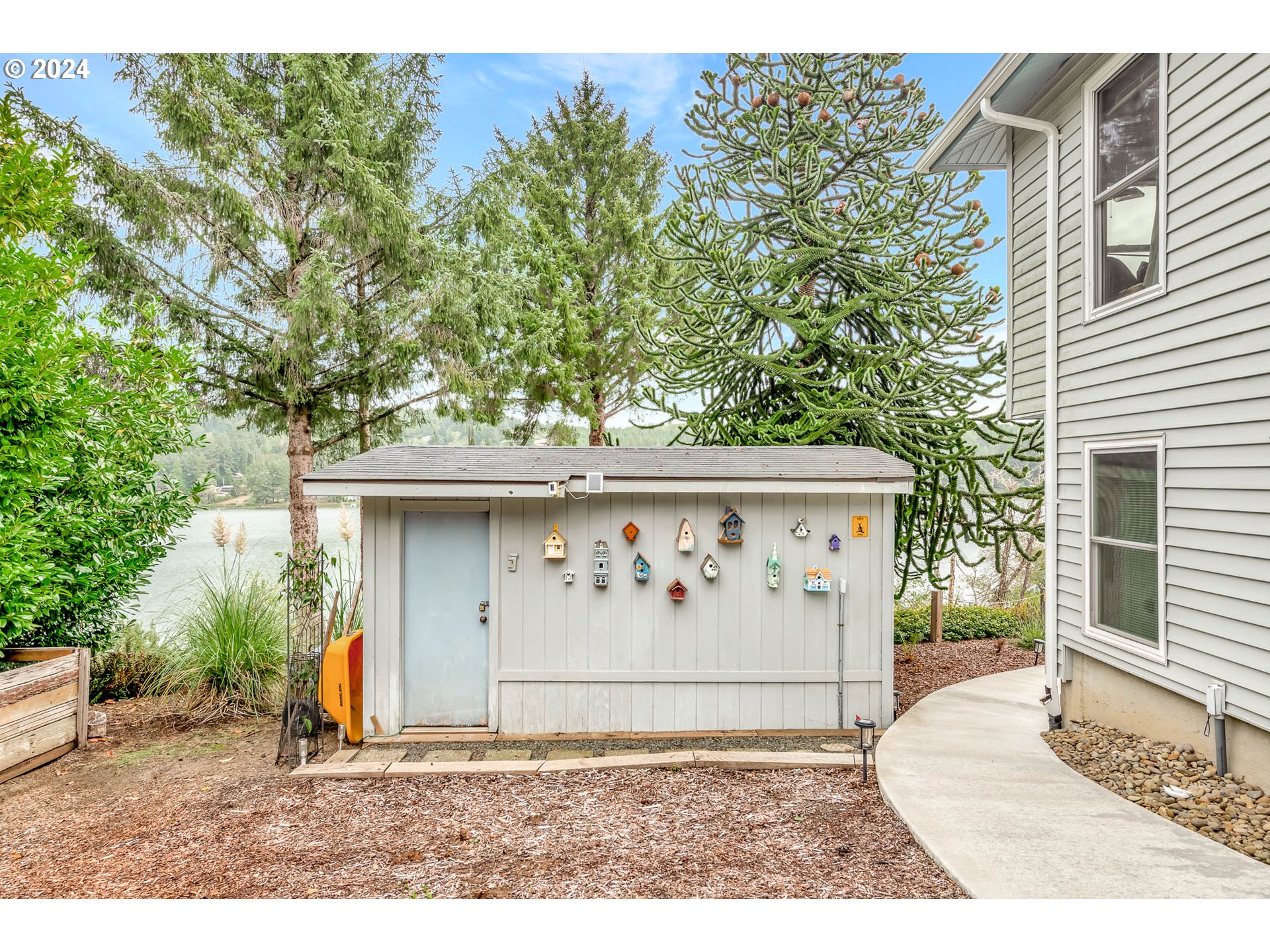5378 Buckskin Bob Road Florence, OR 97439 - Photo 39 of 46 a white house with tree in the background