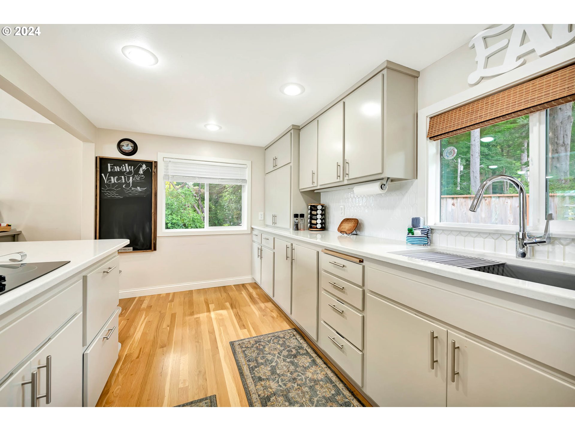5378 Buckskin Bob Road Florence, OR 97439 - Photo 6 of 46 a kitchen with a sink window and cabinets