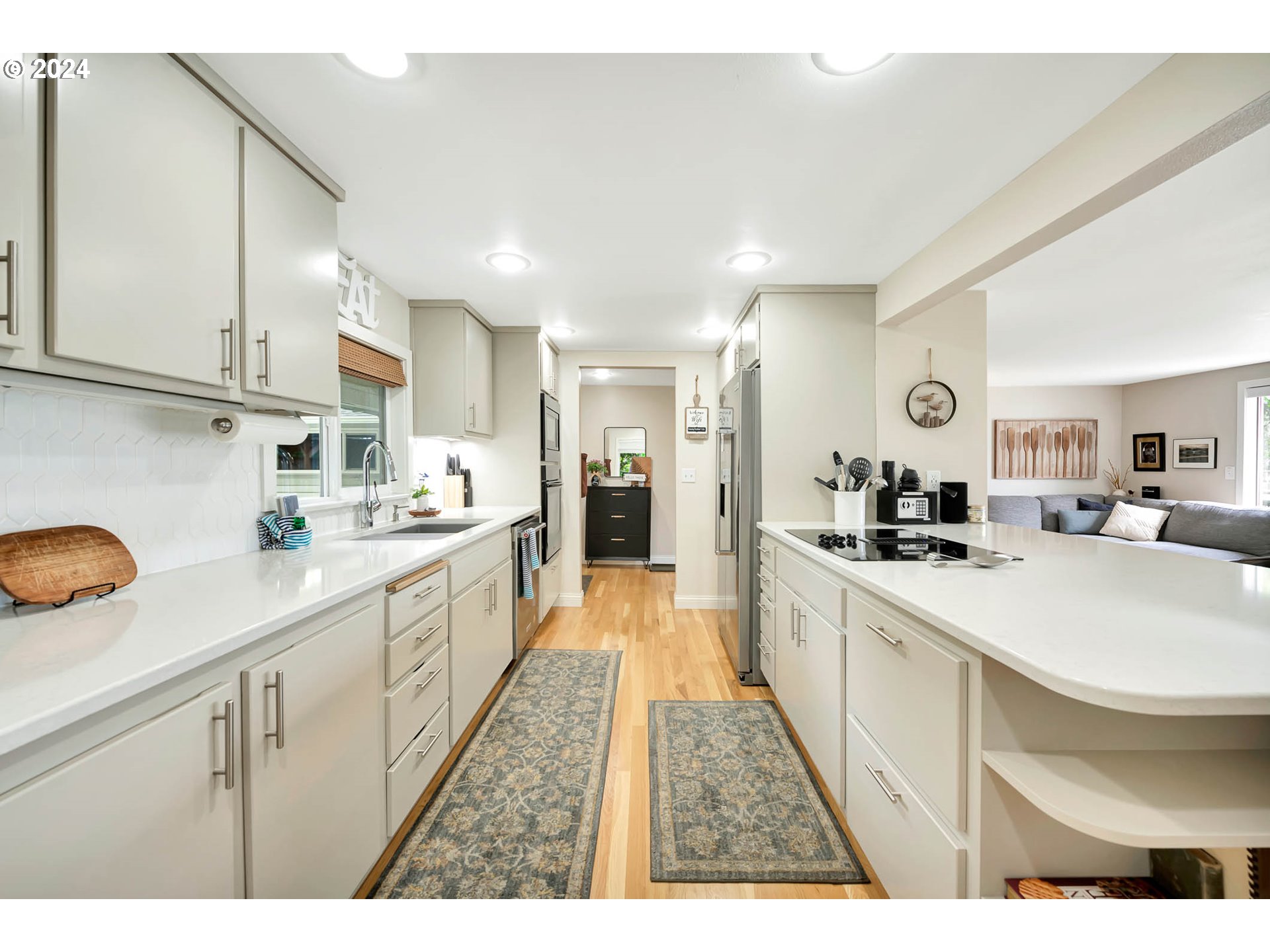5378 Buckskin Bob Road Florence, OR 97439 - Photo 8 of 46 a large white kitchen with stainless steel appliances lots of counter top space