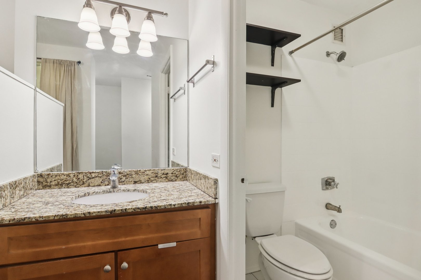 780 South Federal Street, Unit 902 Chicago, IL 60605 - Photo 24 of 28 a bathroom with a granite countertop sink toilet and shower
