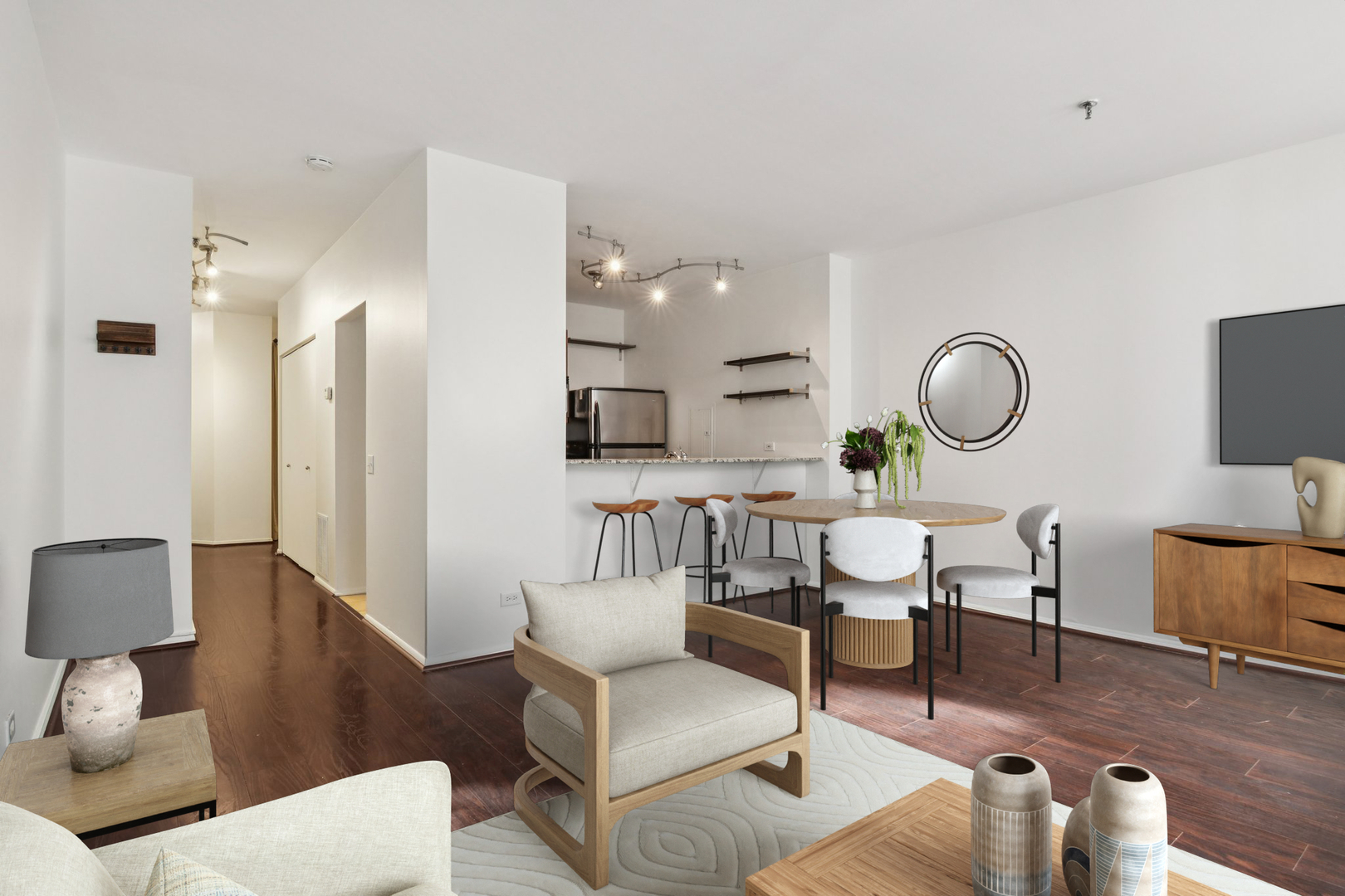 780 South Federal Street, Unit 902 Chicago, IL 60605 - Photo 8 of 28 a living room with furniture a rug and a mirror