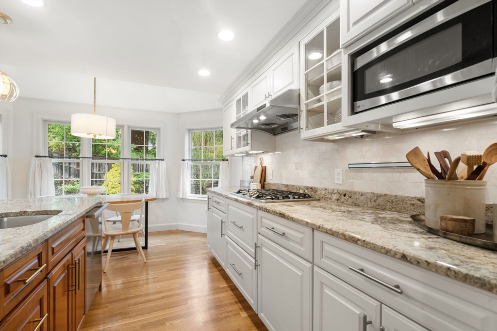 9 Lafayette Circle Wellesley, MA 02482 - Photo 15 of 35 a kitchen with stainless steel appliances granite countertop a stove and a wooden floors