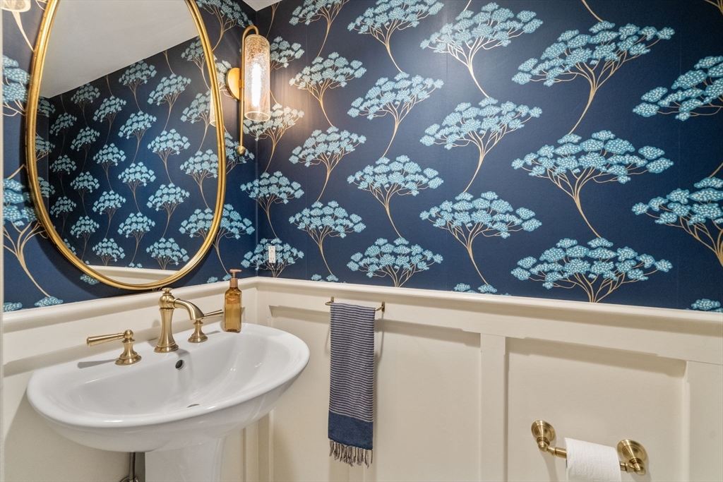 9 Lafayette Circle Wellesley, MA 02482 - Photo 21 of 35 a bathroom with a sink and mirror