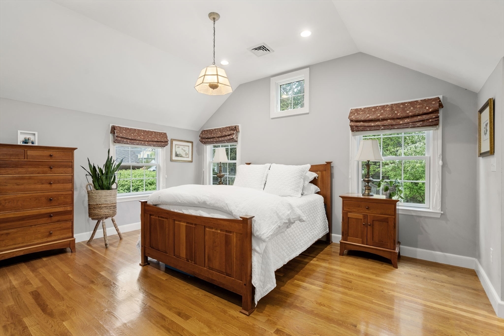 9 Lafayette Circle Wellesley, MA 02482 - Photo 22 of 35 a spacious bedroom with a bed and a window