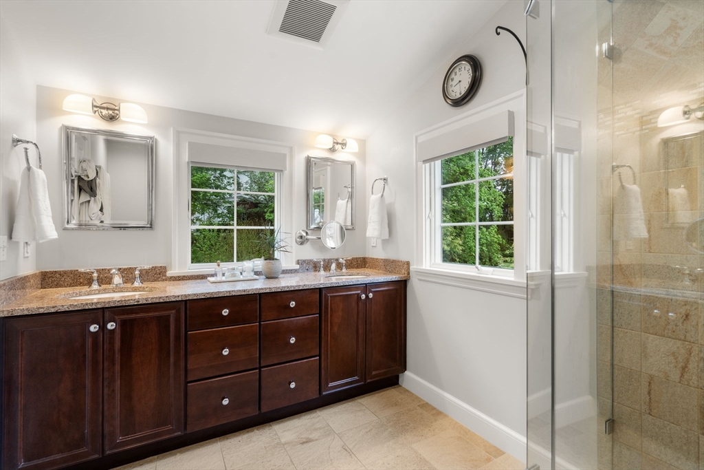 9 Lafayette Circle Wellesley, MA 02482 - Photo 23 of 35 a spacious bathroom with a granite countertop sink mirror and double