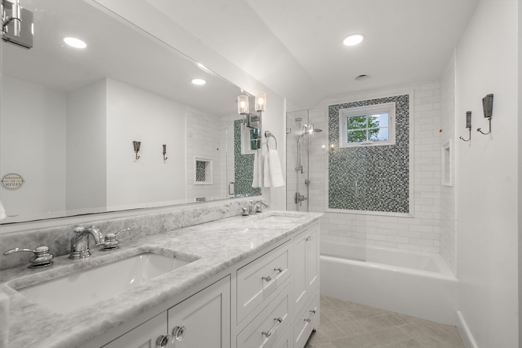 9 Lafayette Circle Wellesley, MA 02482 - Photo 25 of 35 a bathroom with a granite countertop sink mirror and bathtub