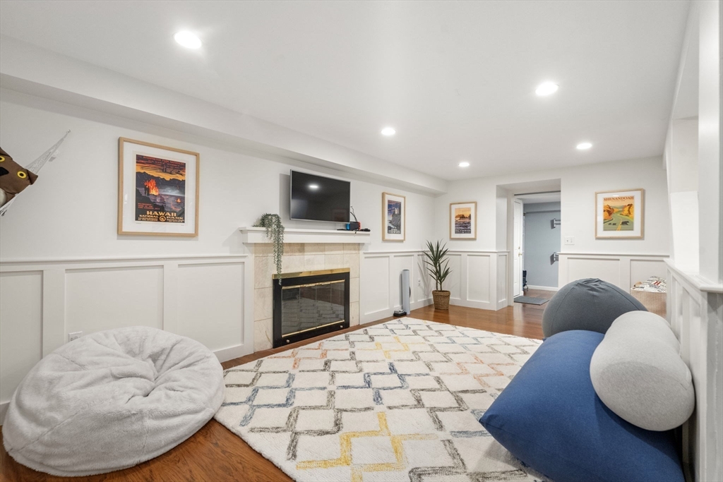 9 Lafayette Circle Wellesley, MA 02482 - Photo 29 of 35 a living room with furniture and a fireplace