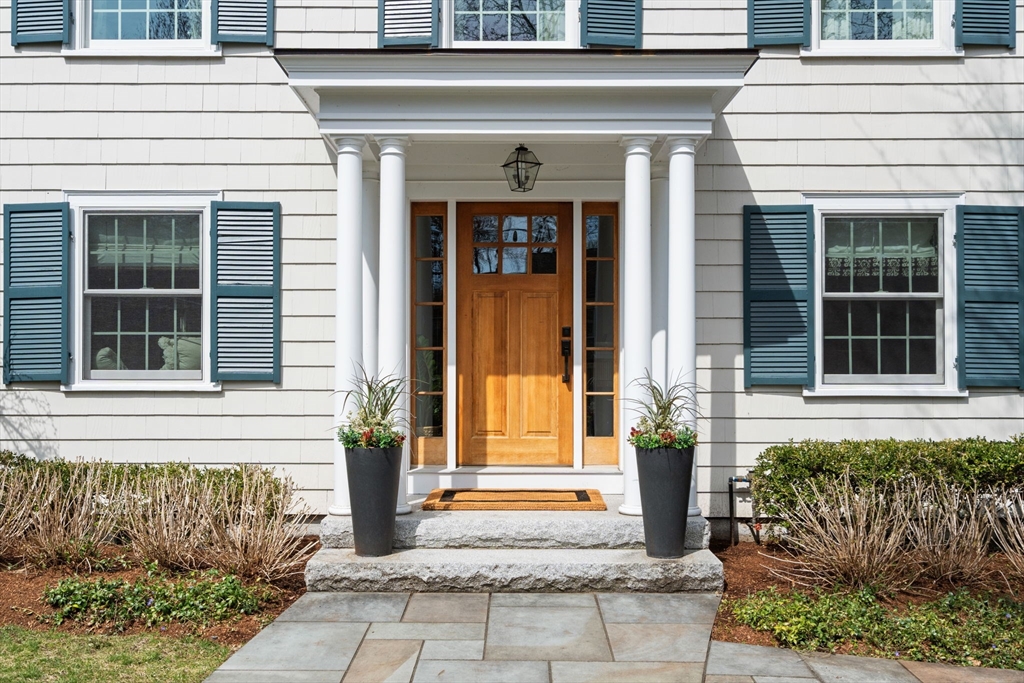 9 Lafayette Circle Wellesley, MA 02482 - Photo 3 of 35 a front view of a house with a porch