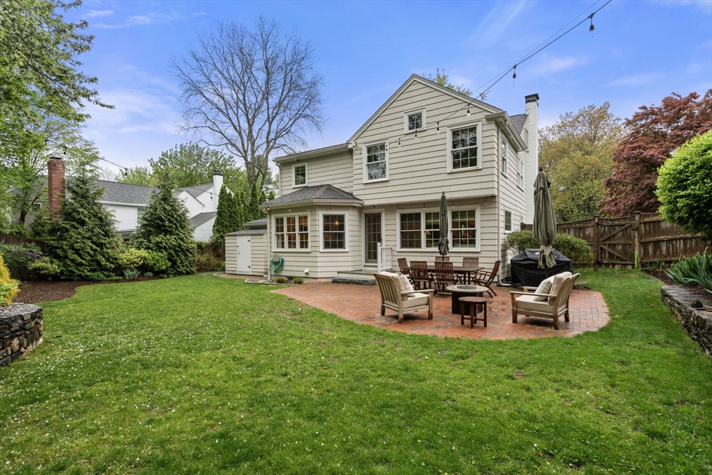 9 Lafayette Circle Wellesley, MA 02482 - Photo 32 of 35 a front view of house with yard and outdoor seating
