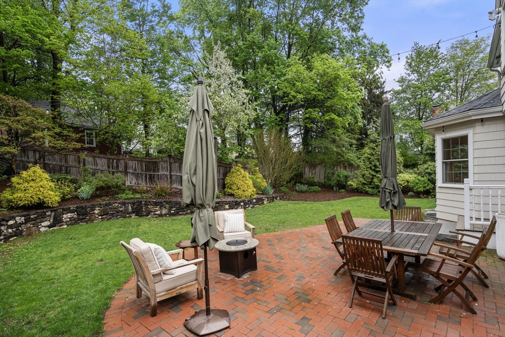 9 Lafayette Circle Wellesley, MA 02482 - Photo 33 of 35 a view of a house with backyard sitting area and garden