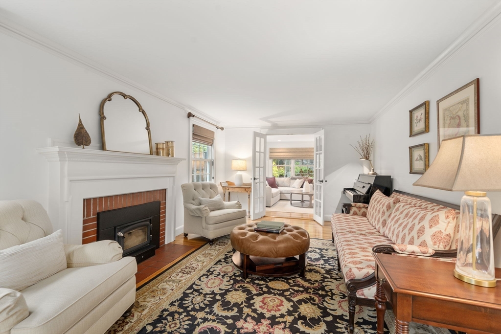 9 Lafayette Circle Wellesley, MA 02482 - Photo 9 of 35 a living room with furniture fireplace and a fireplace