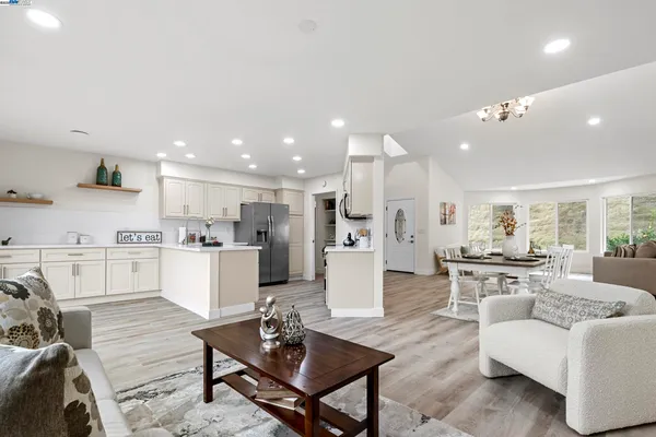 a kitchen with sink a refrigerator and cabinets