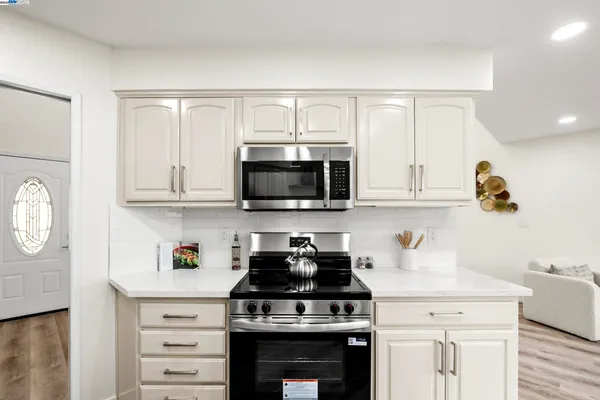 a kitchen with sink and cabinets