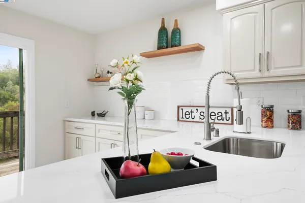 a bedroom with a bed and a lamp on table