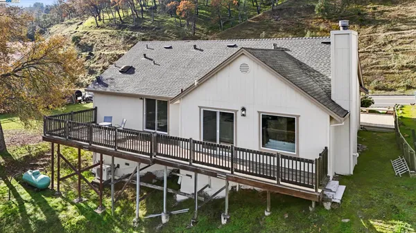 a view of balcony with two chairs and wooden floor