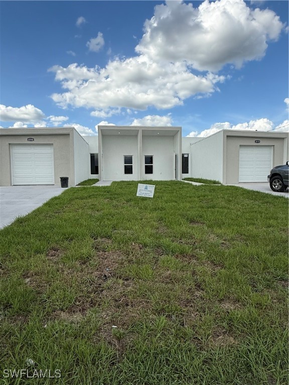 1015 Jaguar Boulevard Lehigh Acres, FL 33974 - Photo 1 of 9 a view of a backyard of the house