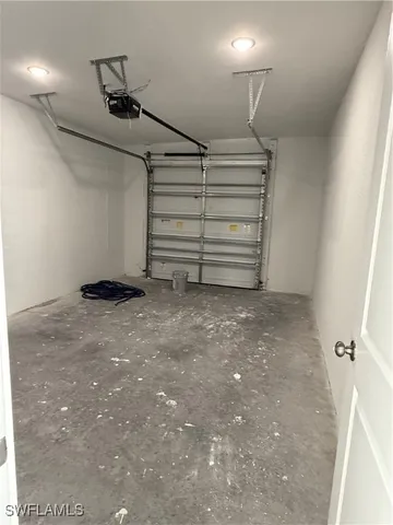 a view of room that has a white walls