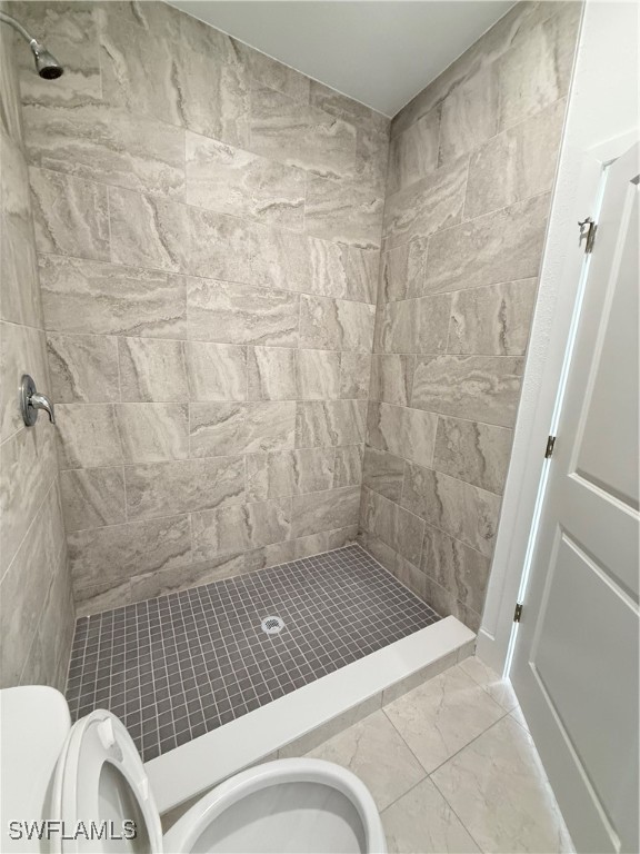 1015 Jaguar Boulevard Lehigh Acres, FL 33974 - Photo 8 of 9 a bathroom with a sink and a shower