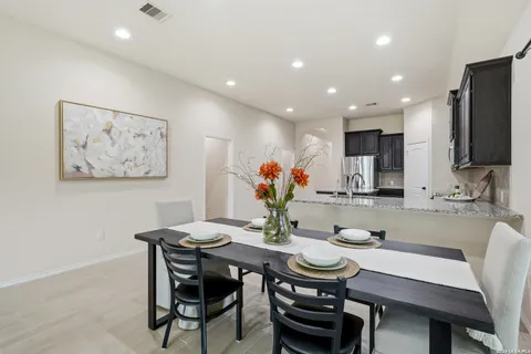 a view of a dining room with furniture