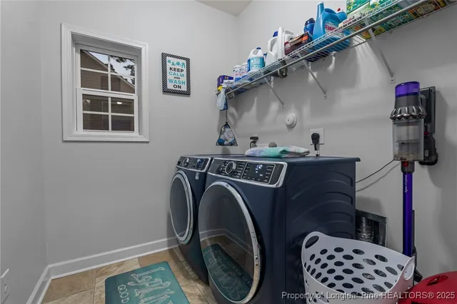 a bedroom with a bed couch and window