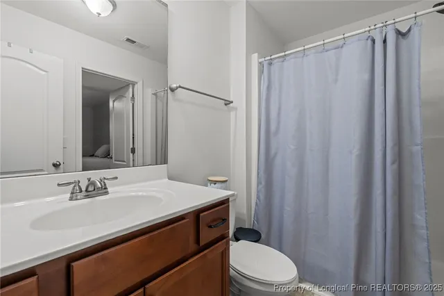 a view of a patio with table and chairs and potted plants