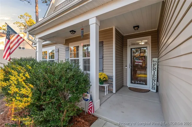 a view of a brick house with potted plants