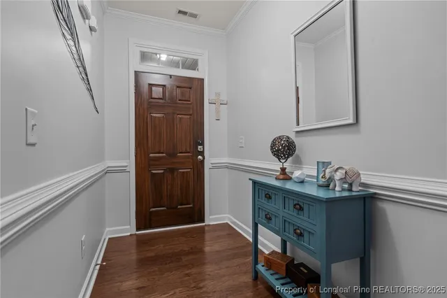 a room with a window and wooden floor